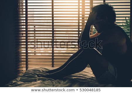 Stock photo: Depressed Man Sitting On Bed