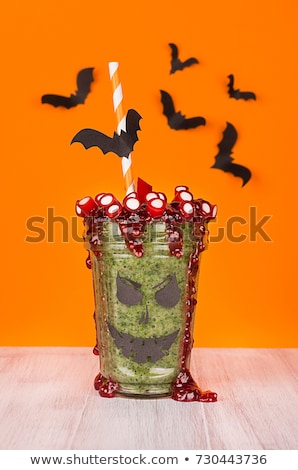 ストックフォト: Halloween Food Fun Monsters Smoothie On Orange Background Vertical