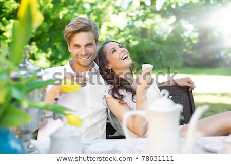 Сток-фото: Happy Couple Drinking A Cappuccino Outdoors