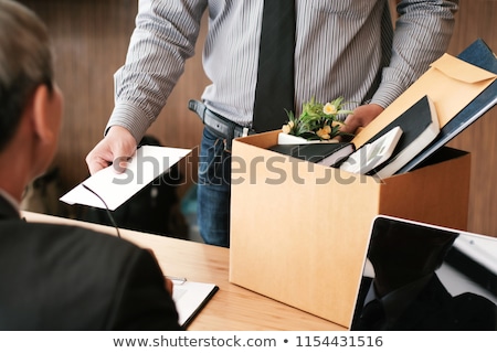 Stok fotoğraf: Businessman Hand Sending A Resignation Letter To Executive Boss