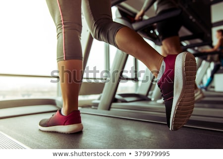 Stockfoto: Close Up Of Woman With Trainer Working Out On Treadmill In Gym