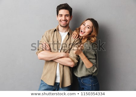 Foto stock: Cheerful Young Couple Standing