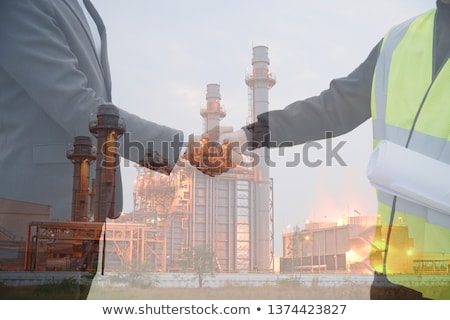 Foto stock: Worker And Investor In Solar Power Plant