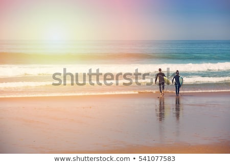 Stock fotó: Beach Activities Man And Woman On Surfboards