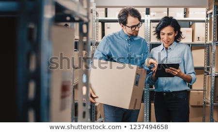 Stock foto: Delivery Woman Holding Cardboard Box And Tablet