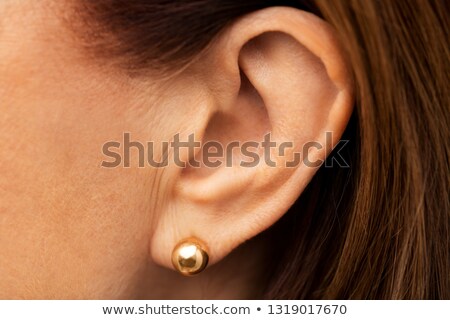 Stockfoto: Close Up Of Senior Woman Ear With Golden Earring