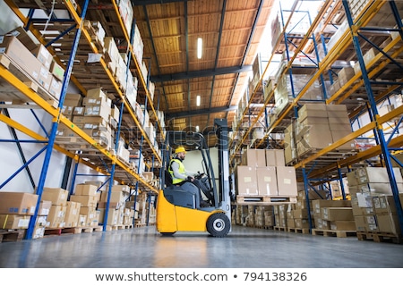 Foto stock: Forklift In Warehouse