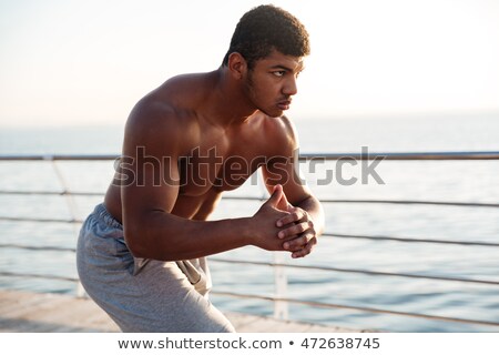Stok fotoğraf: Young Shirtless Afro American Sportsman Doing Squats On The Pier