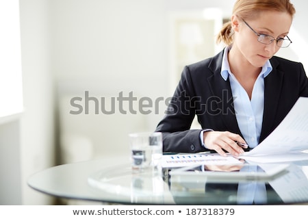 ストックフォト: A Woman At The Office Reading