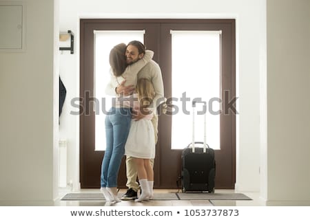 Stock photo: Man And Woman Hugging In The Doorway