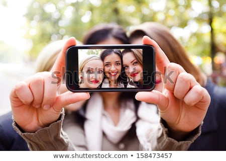 Foto d'archivio: Woman Taking Selfie By Smartphone At Autumn Park