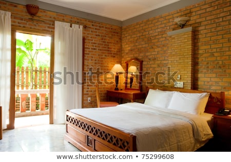 Foto stock: Bed And Lamp In Hut