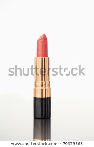Foto d'archivio: A Pale Red Lipstick Against A White Background