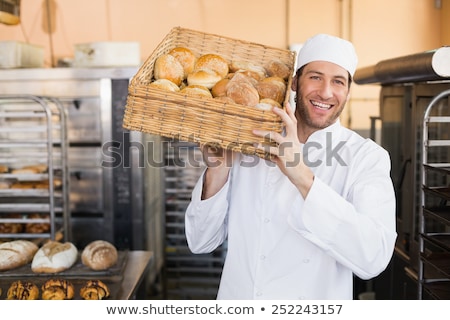 ストックフォト: Man In Chef Uniform With Bread Basket