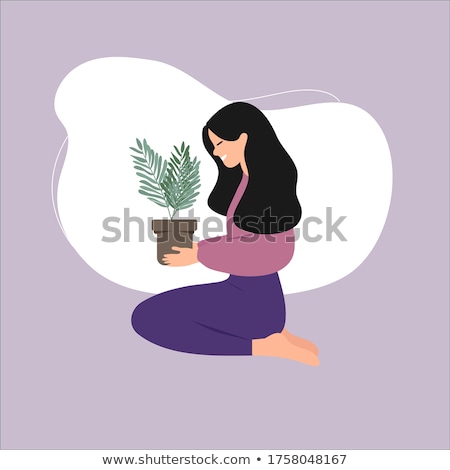 ストックフォト: Lifestyle Attractive Girl With Grass In Pot