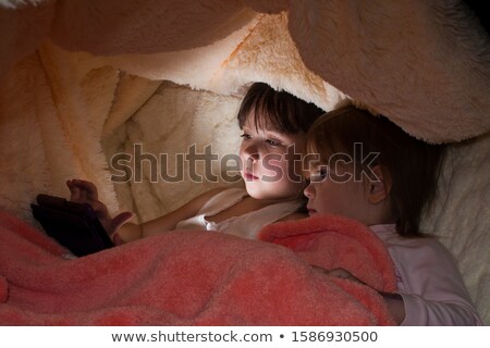 Foto stock: Four Year Old Girl Is In Bed Under The Blanket