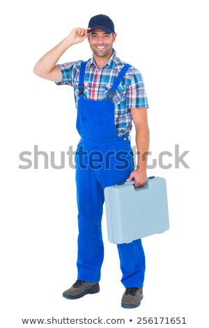 ストックフォト: Happy Manual Worker Wearing Cap While Carrying Toolbox