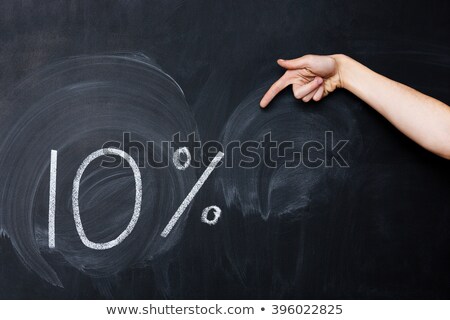 Foto stock: Hand Pointing At Ten Percent Drawn On Blackboard