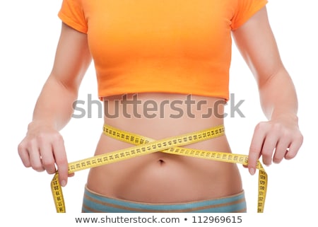 Stok fotoğraf: Young Woman With Centimeter In Weight Loss Concept