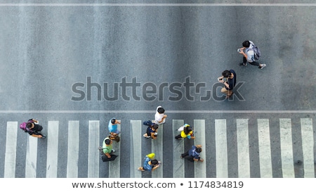 Foto stock: Girl Walking With Smartphone On Pedestrian Crossing