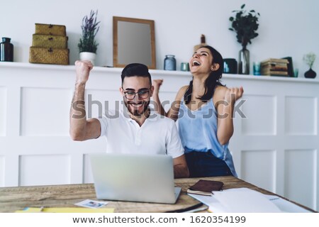 Foto stock: Cheerful Screaming Business Man Using Computer And Rejoices