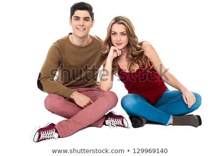 Cheeky Boy Cross Legged Sitting On The Floor Foto stock © stockyimages