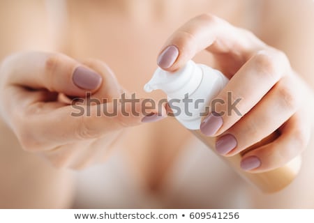 Stock photo: Beautiful Woman With Moisturizing Creme Drop