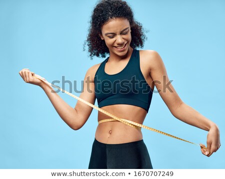 ストックフォト: Fitness Model With Tape Measure