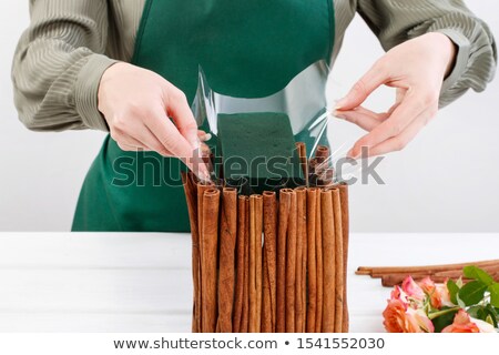 Stok fotoğraf: Bunch Of Cinnamon Sticks On Rustic Table