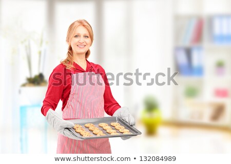 Сток-фото: Woman Posing With Cookies Baking In The Oven