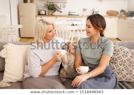 Stok fotoğraf: Beautiful Woman Having Coffee On Sofa