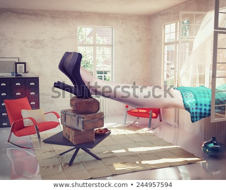 Zdjęcia stock: Legs Of Giant Woman In Tiny Room