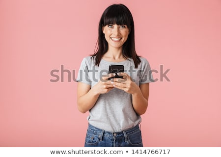 Stock photo: Beautiful Amazing Young Woman Posing Isolated Over Pink Wall Background