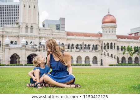 Сток-фото: Mom And Son On Background Of Merdeka Square And Sultan Abdul Samad Building Traveling With Children