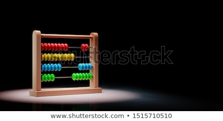 Foto d'archivio: Abacus Spotlighted On Black Background