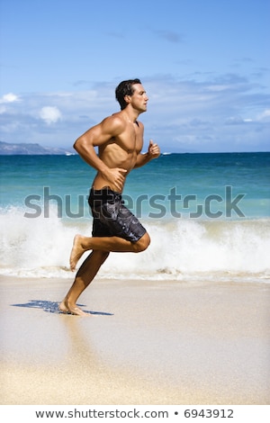 Hunk On Beach Stock fotó © iofoto