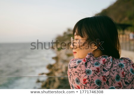 Сток-фото: Glamour Woman Standing Next To A Rock