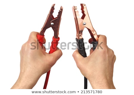 ストックフォト: Hands With Jumper Cables On White