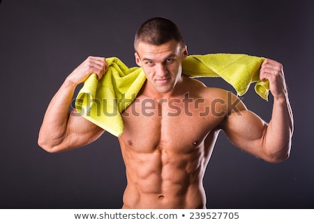 Foto stock: Mid Section Of A Shirtless Muscular Man In White Towel