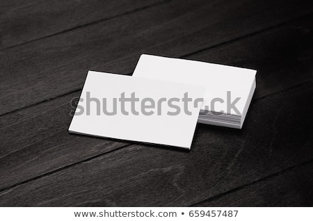 Foto stock: Blank Corporate Identity Business Card And Stack On Black Stylish Wood Background With Blur Templat