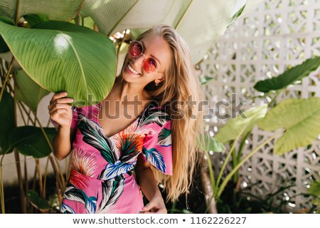 Stock photo: Pretty Girl Standing Near Plants In Greenery