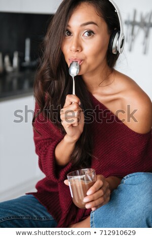 Сток-фото: Lovely Young Asian Woman In Headphones Eating Dessert