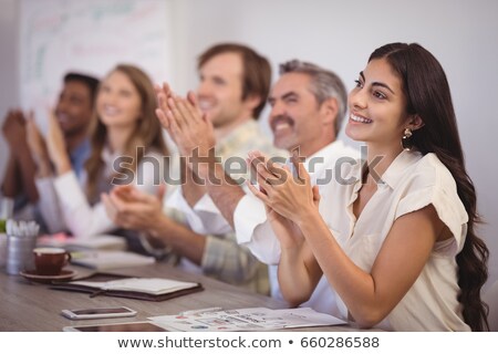 Zdjęcia stock: Executives Applauding During Presentation In Conference Room