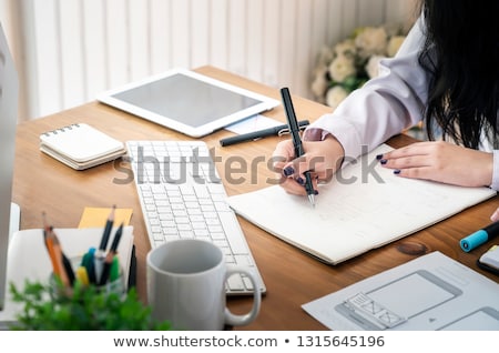 Stock photo: Designer Editor At Work Drawing Sketches A New Project On Graphi