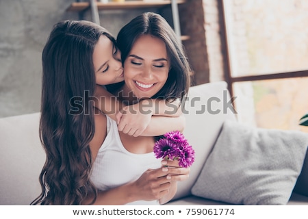 Stockfoto: Girls Hand Giving Birthday Gift To Her Mother