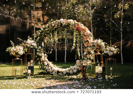 Stock photo: Decoration Wedding Arch With White And Pink Flowers On A Green Natural Background