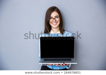 Stockfoto: Pretty Smiling Happy Secretary With Notebook Standing In Studio