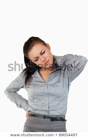 ストックフォト: Portrait Of A Businesswoman Having Back Pain Against A White Background