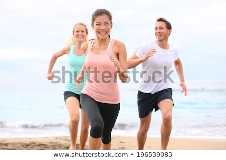 Сток-фото: Three Friends Running Outdoors Smiling