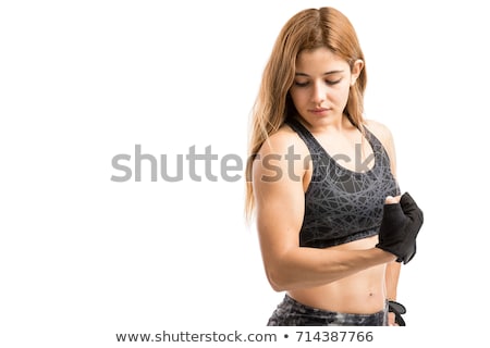 Сток-фото: Young Woman Showing Off Her Muscle